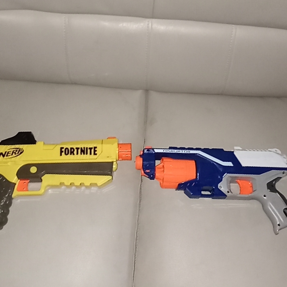 2 nerf guns one yellow one blue